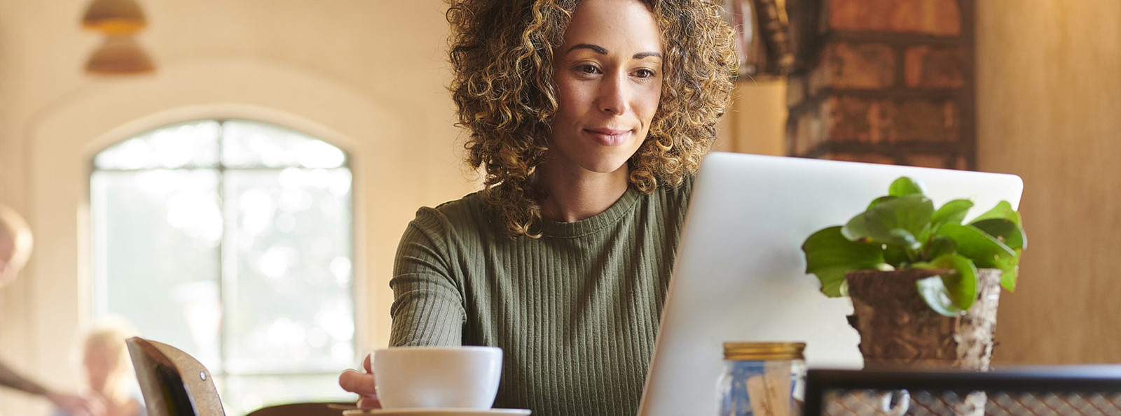 Home business person looking at their laptop.