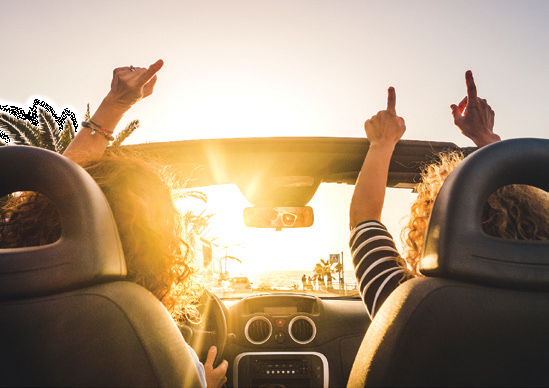 People riding in a convertable 