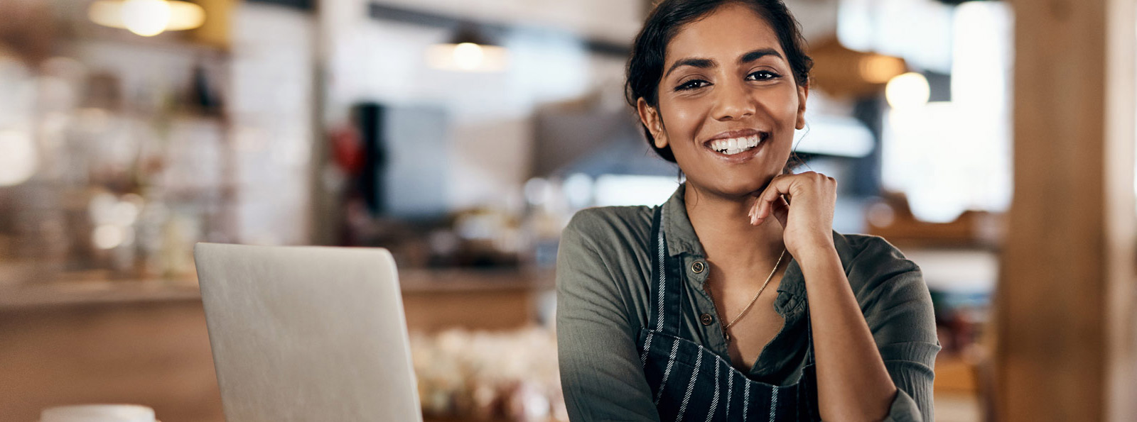 Business person in front of a laptop.