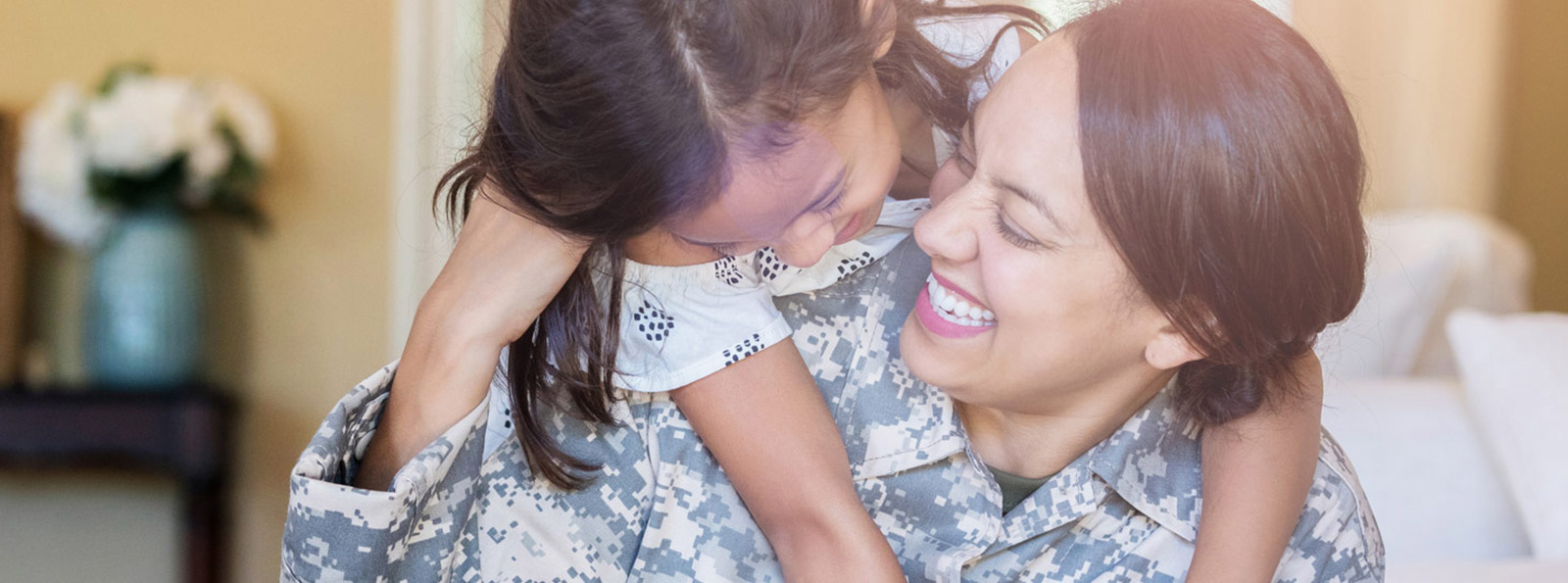 Mother and daughter playing and laughing.
