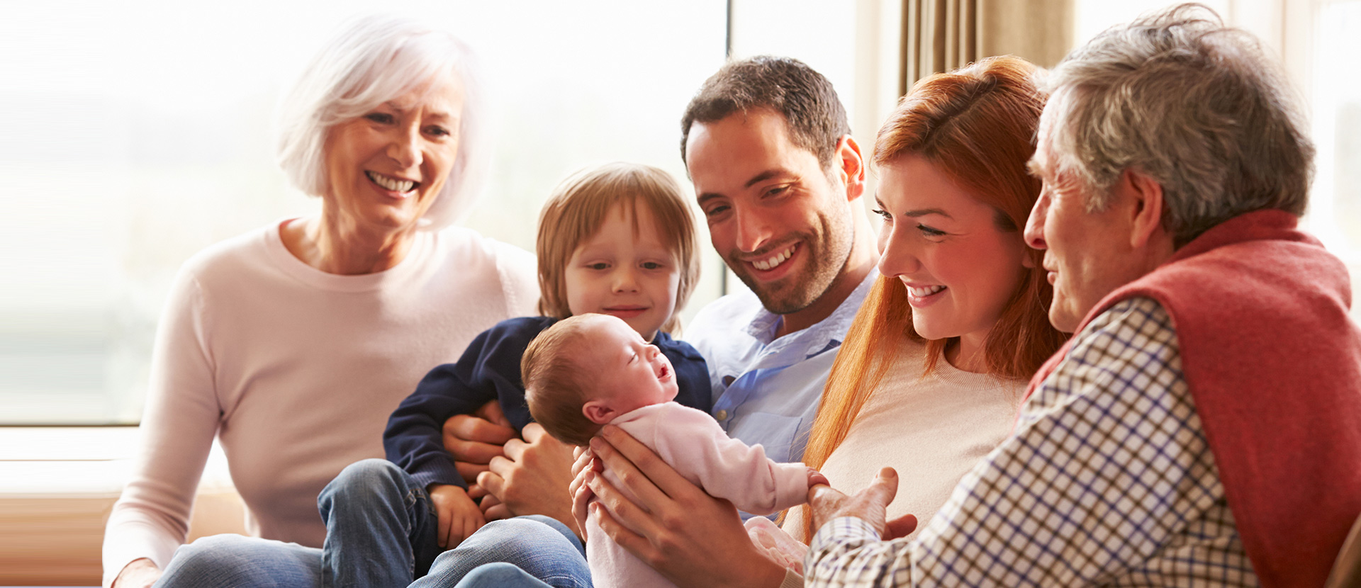 a family gathered around a new born
