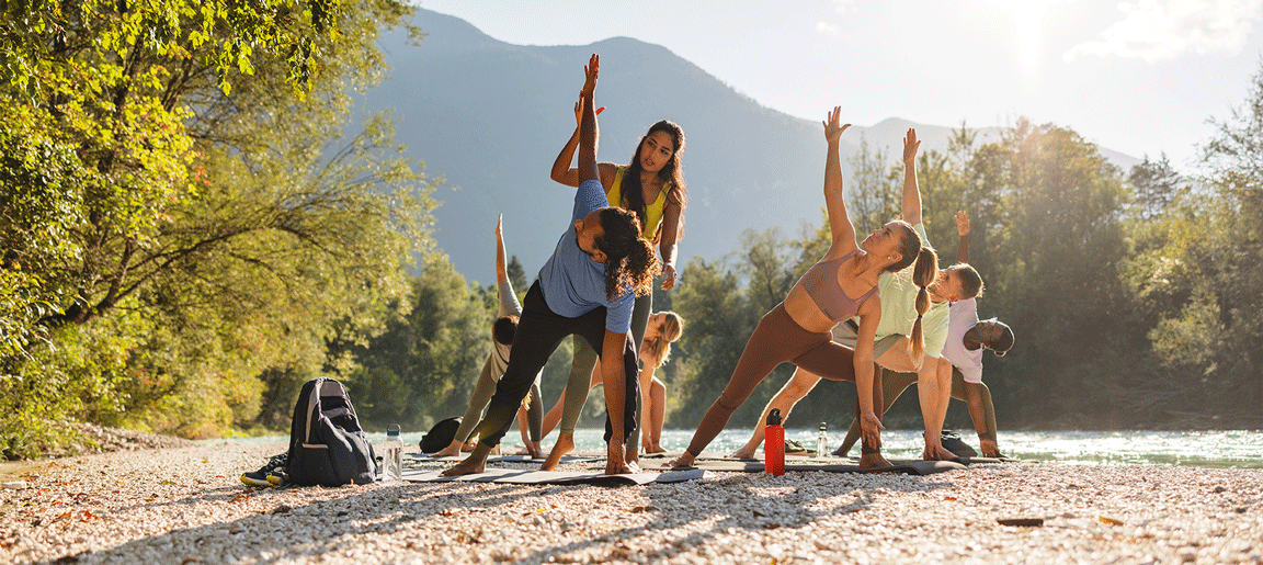 People doing yoga outdoors