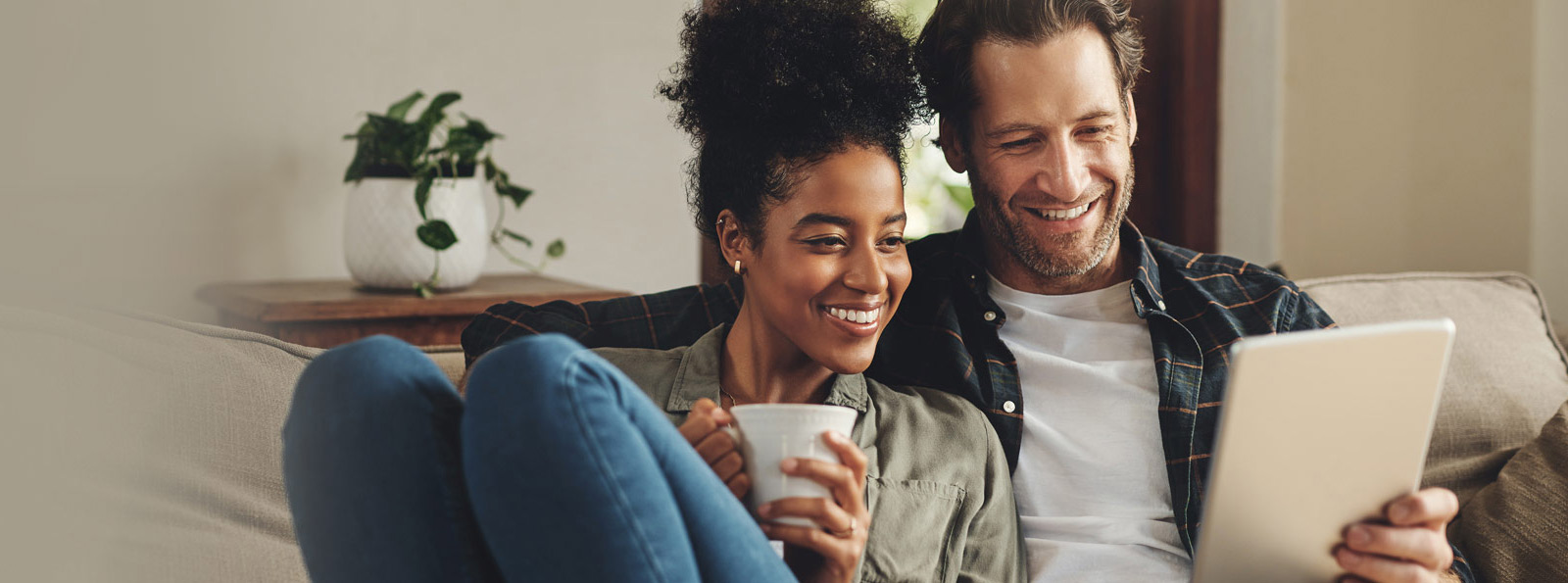 Couple looking at a tablet together.