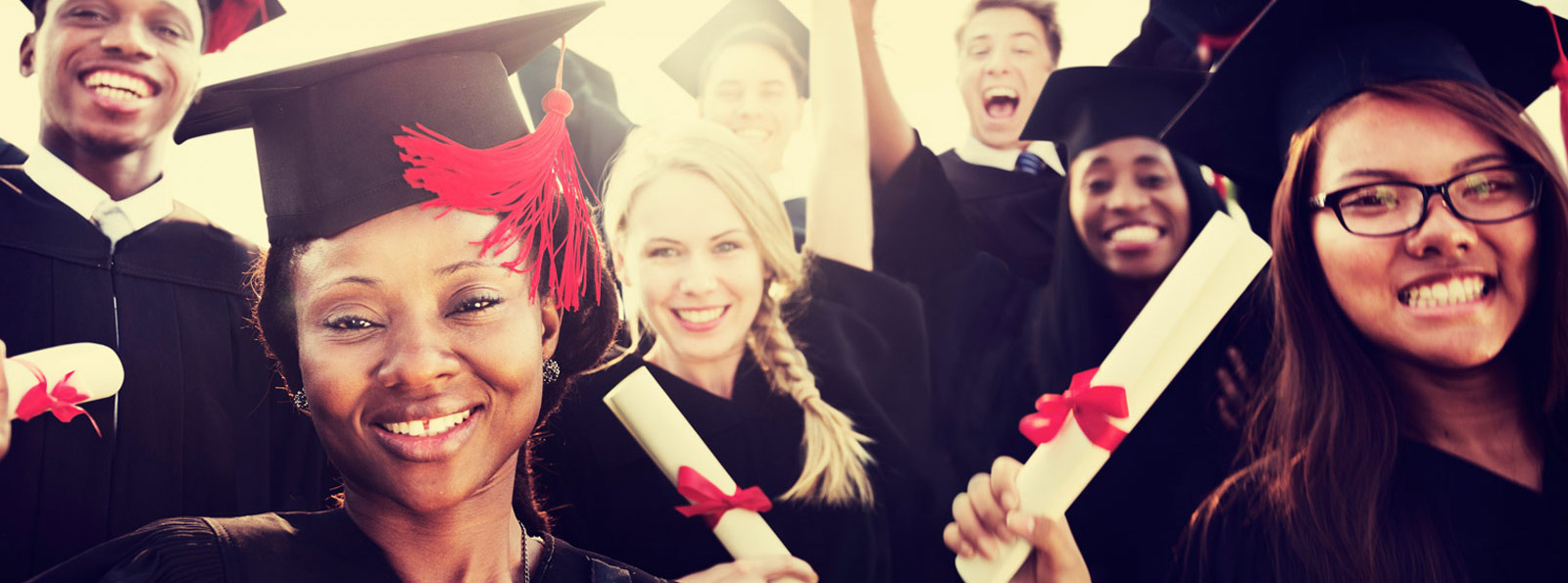 New graduates smiling.