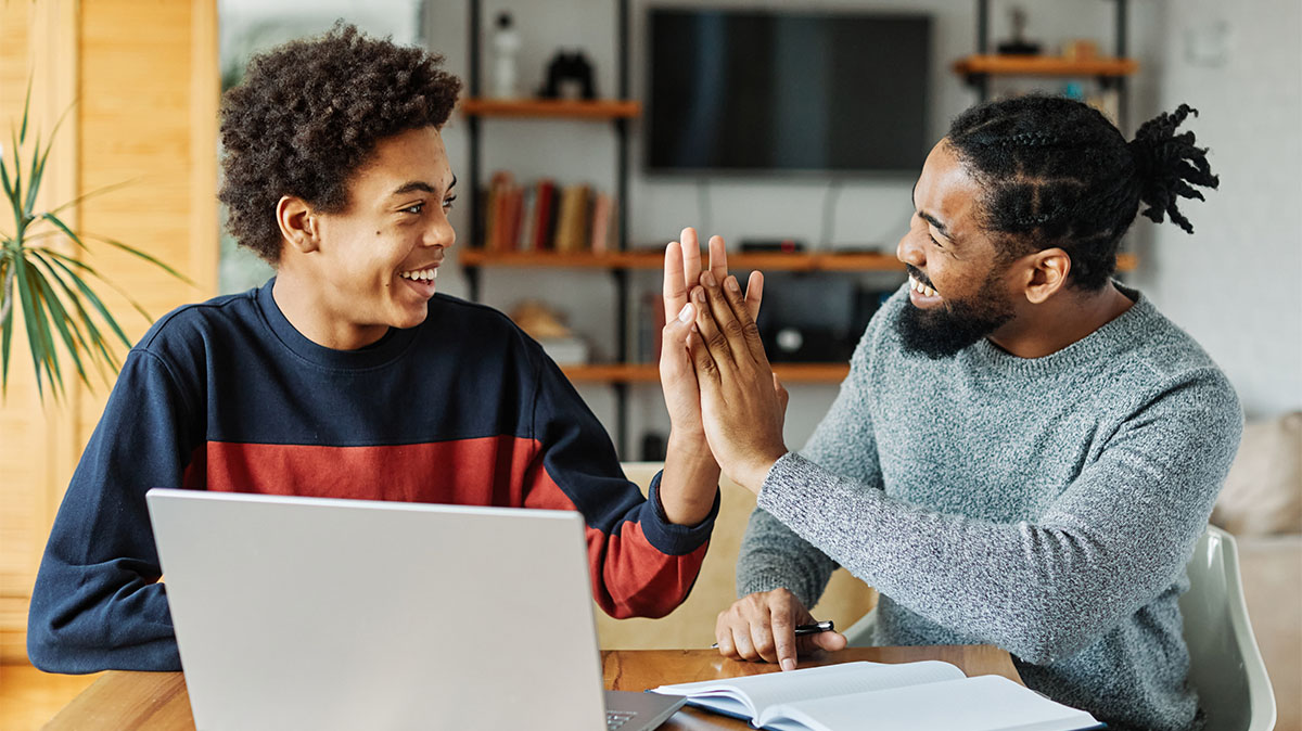 Two people high-fiving