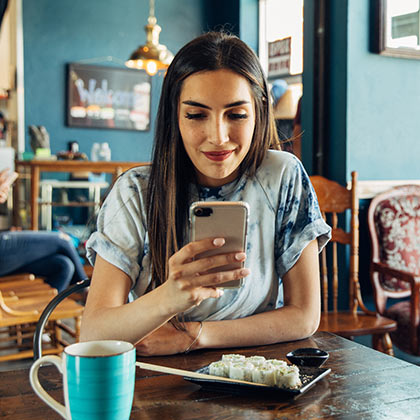 Person looking at app on their phone.